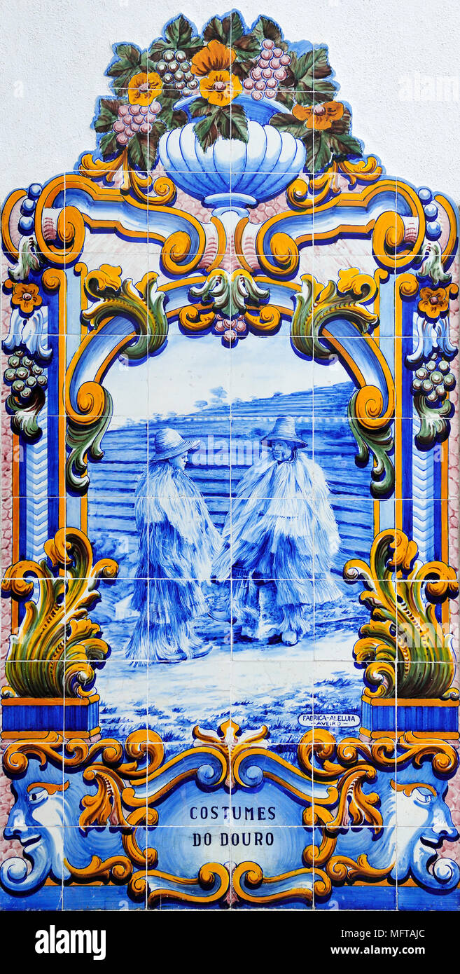 Traditional blue tiles (Azulejos) showing the work related with the Port Wine. Railway station of Pinhão, Douro region. A Unesco World Heritage Site,  Stock Photo