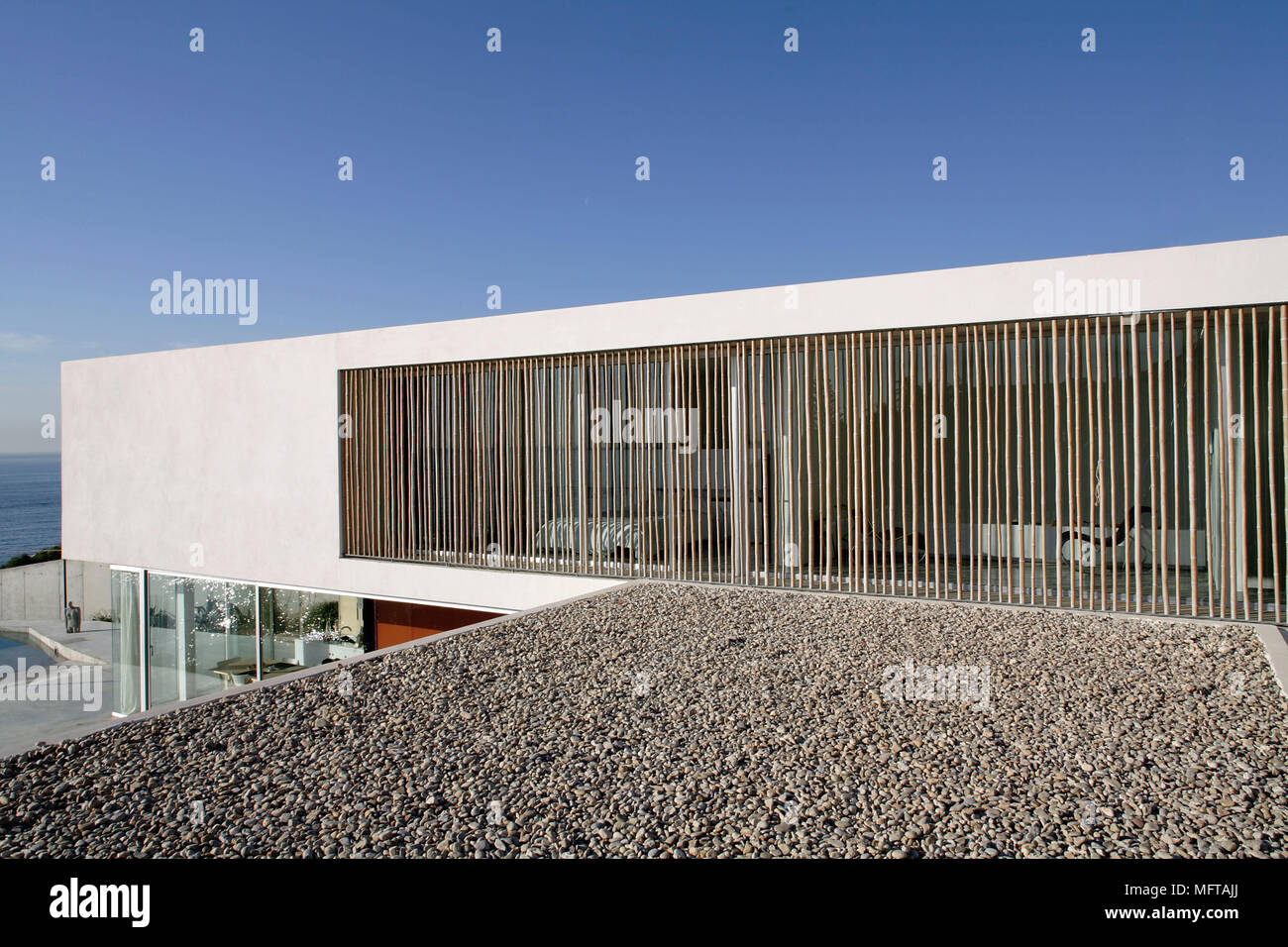 Exterior Of Modern House On Different Levels With Window Shaded By Bamboo Poles Stock Photo Alamy