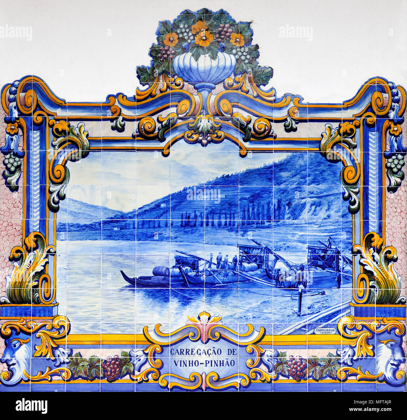 Traditional blue tiles (Azulejos) showing the work related with the Port Wine. Railway station of Pinhão, Douro region. A Unesco World Heritage Site,  Stock Photo