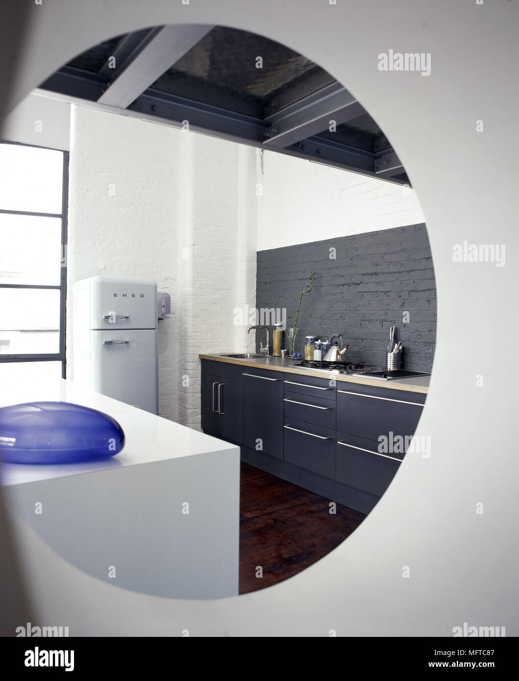Modern Kitchen With Black Painted Brick Wall Beamed Ceiling