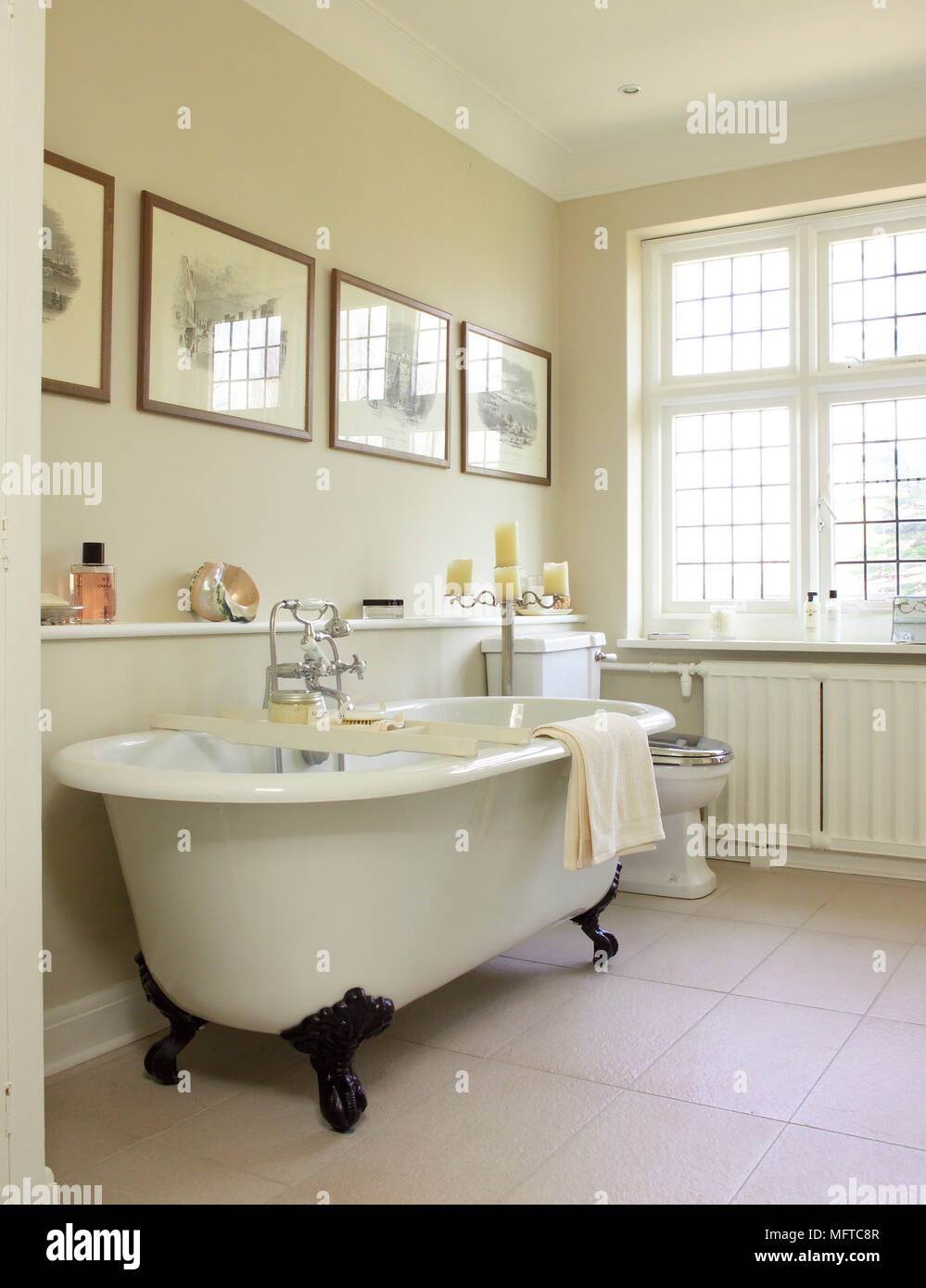 Period style free standing bathtub in traditional style bathroom Stock