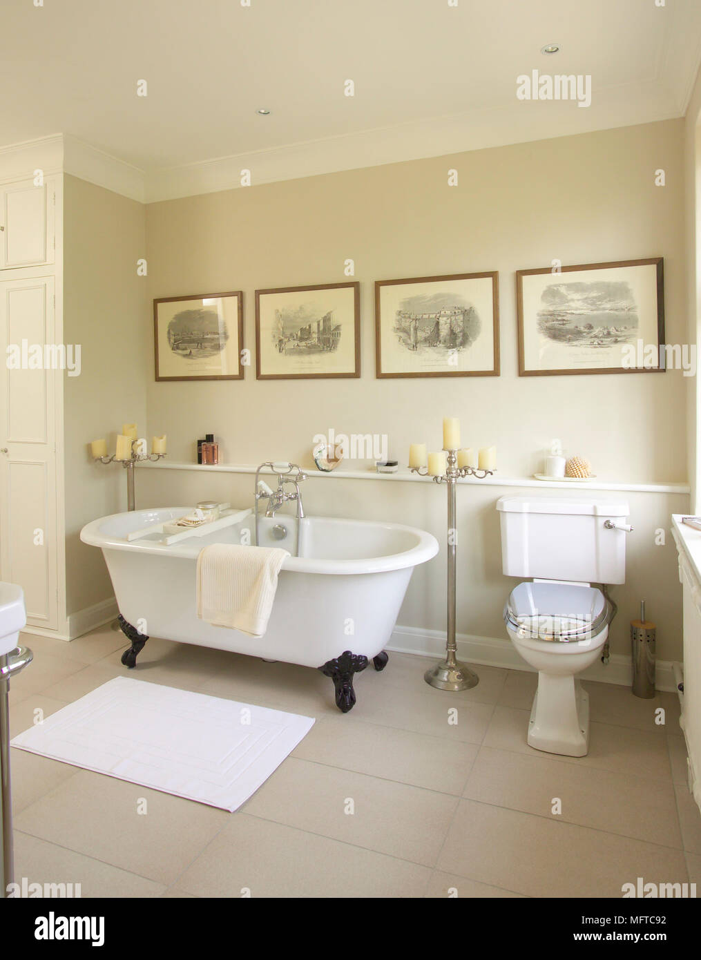 Period style free standing bathtub in traditional style bathroom Stock