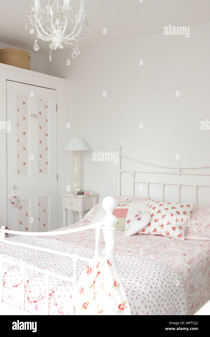 Wrought iron bed in traditional style bedroom Stock Photo Alamy