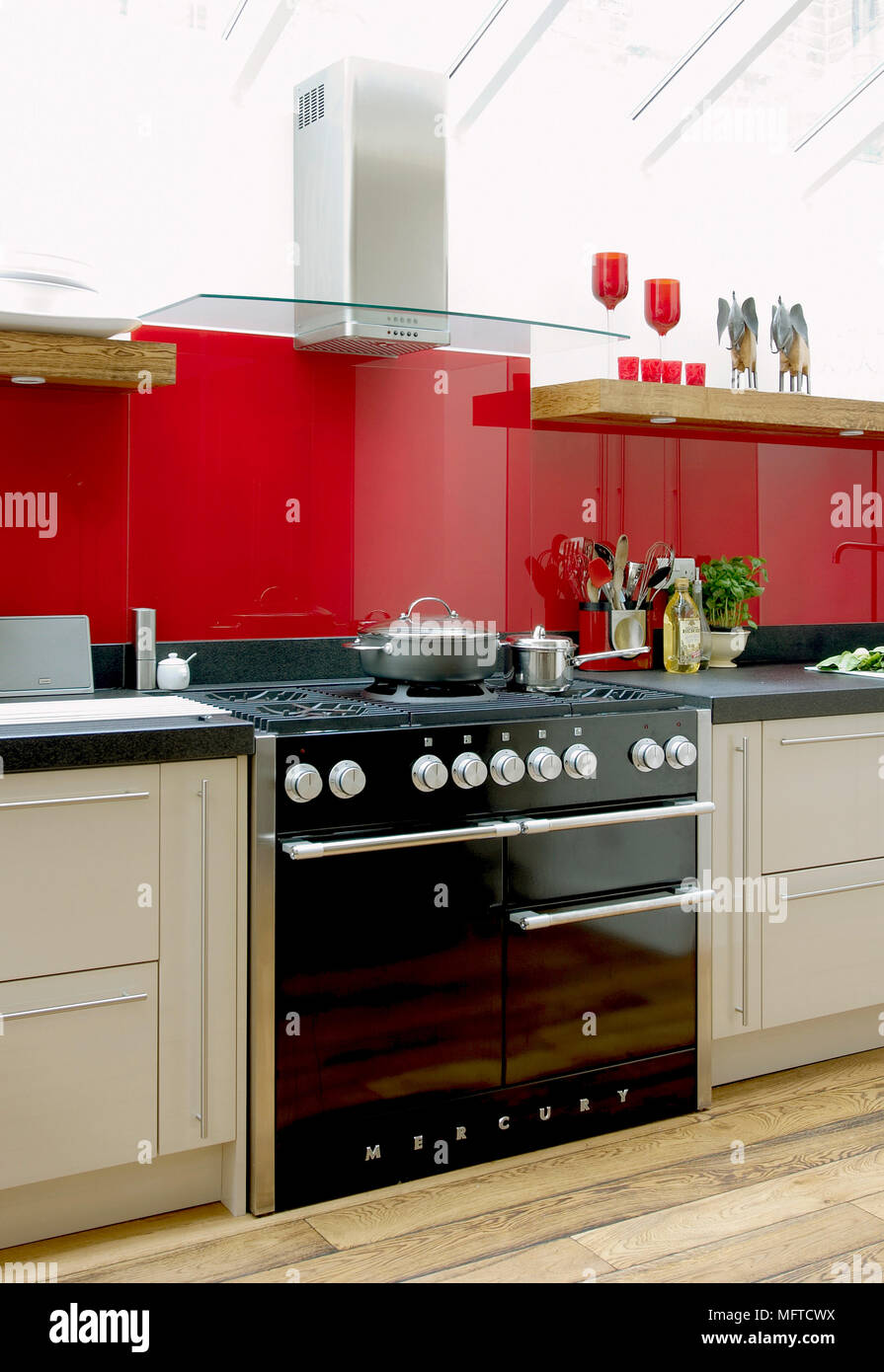 Extractor fan above modern range oven Stock Photo Alamy