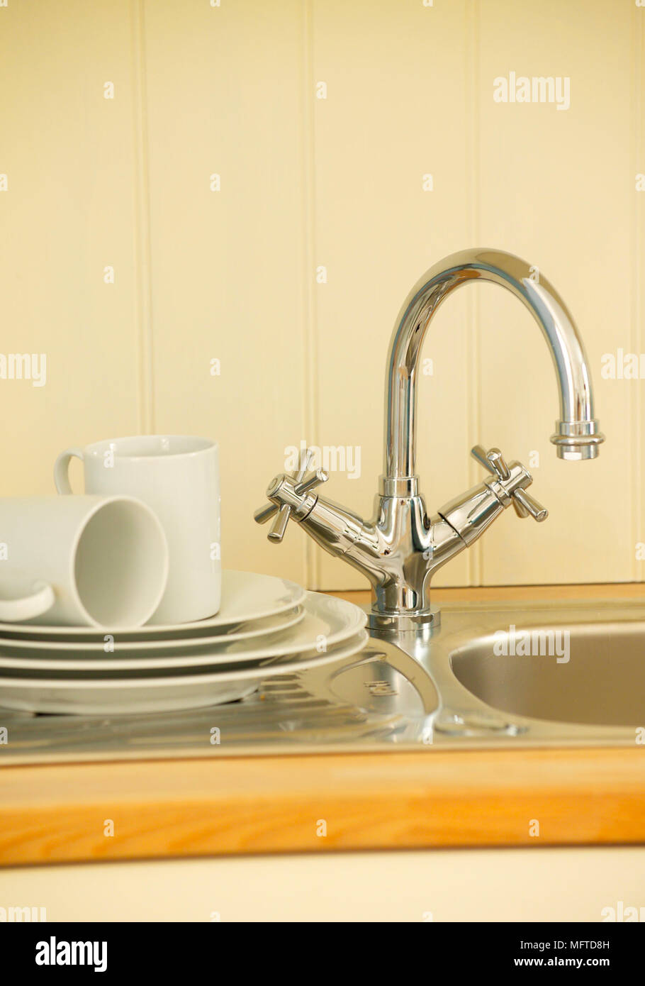 Stainless steel kitchen sink and tap fitting Stock Photo Alamy