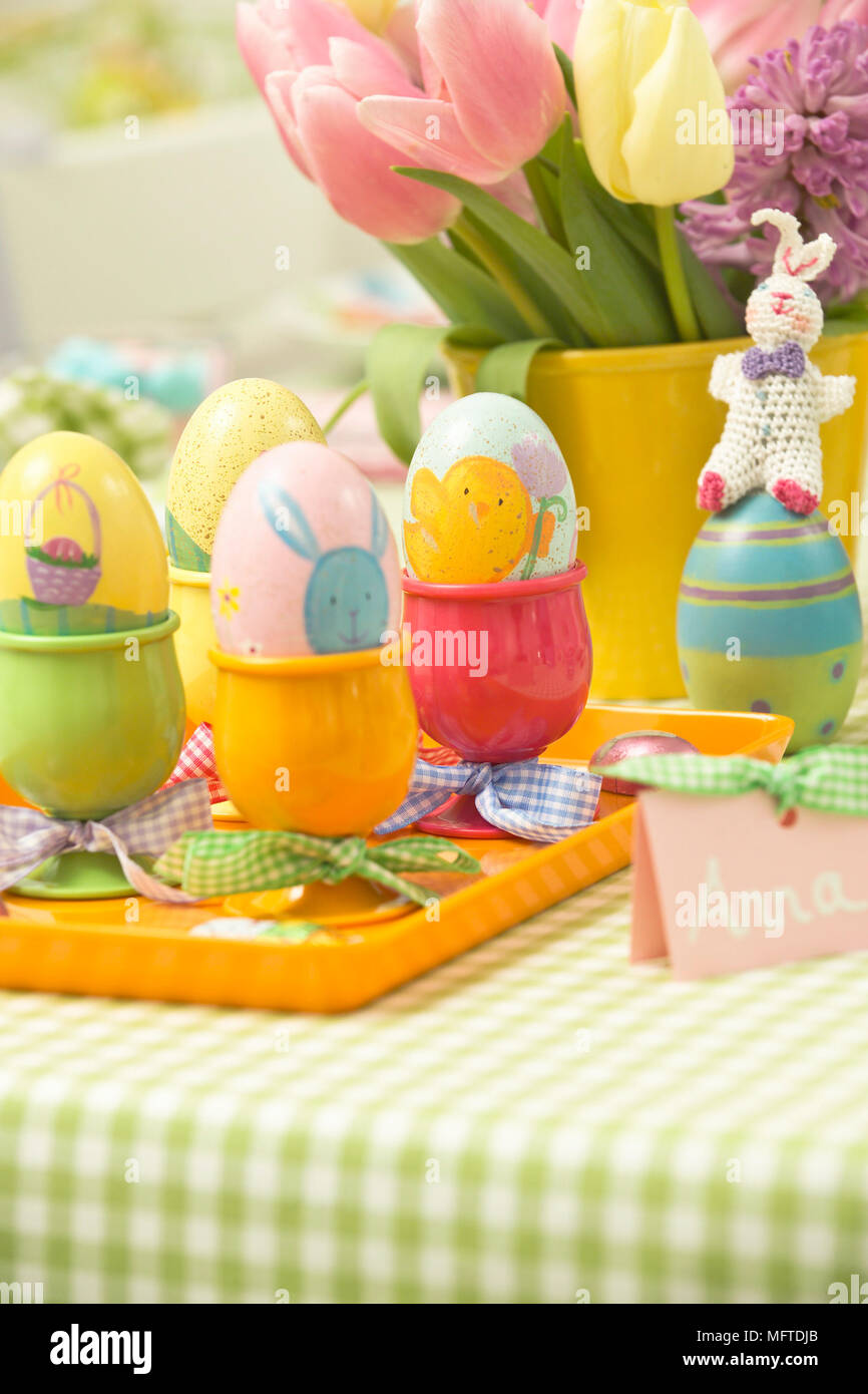 Decorated eggs in cups for Easter lunch Stock Photo
