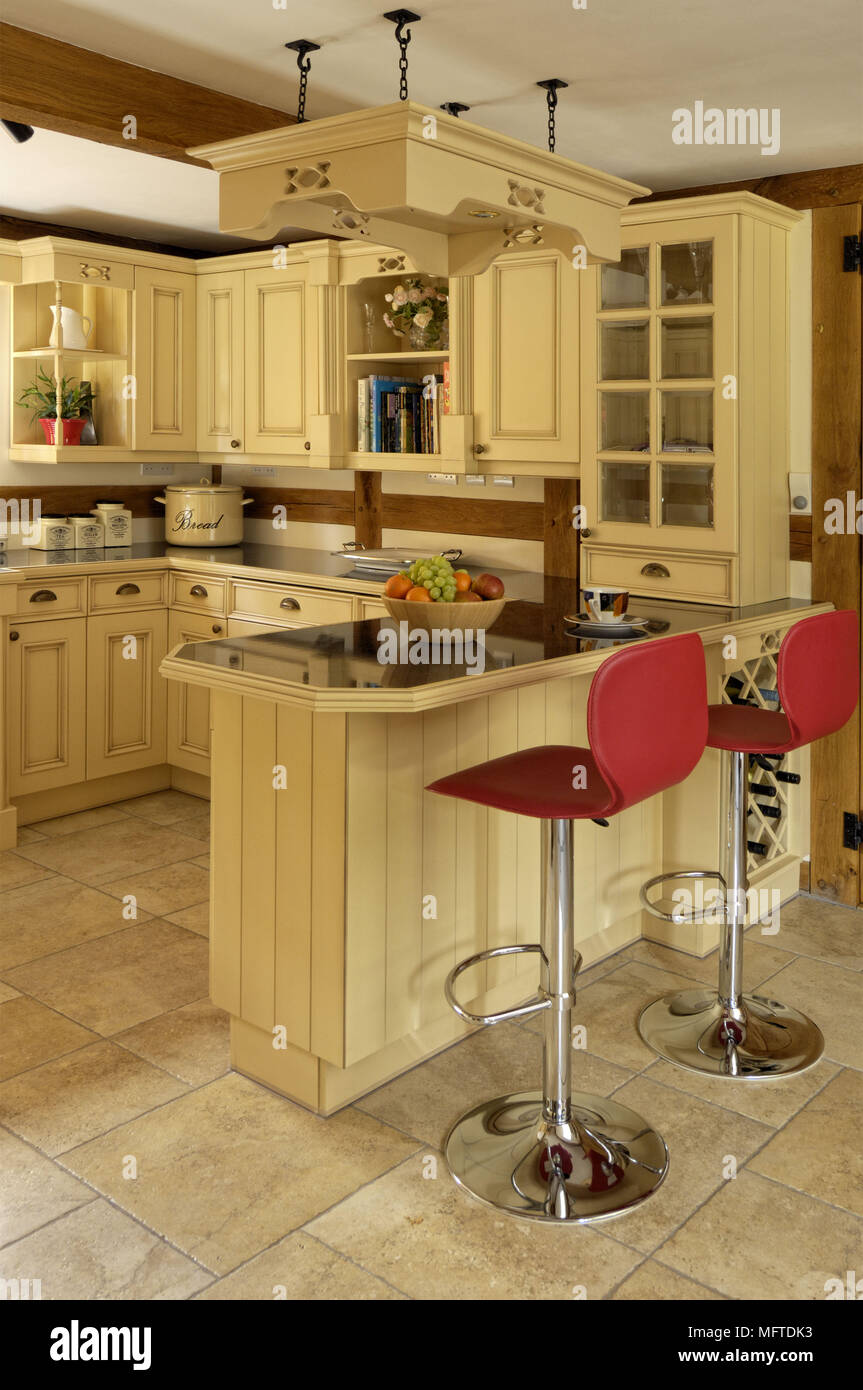 Bar stool at breakfast bar in country style kitchen Stock Photo Alamy
