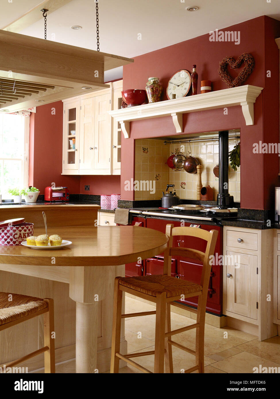 Bar stool at breakfast bar in country style kitchen Stock Photo Alamy