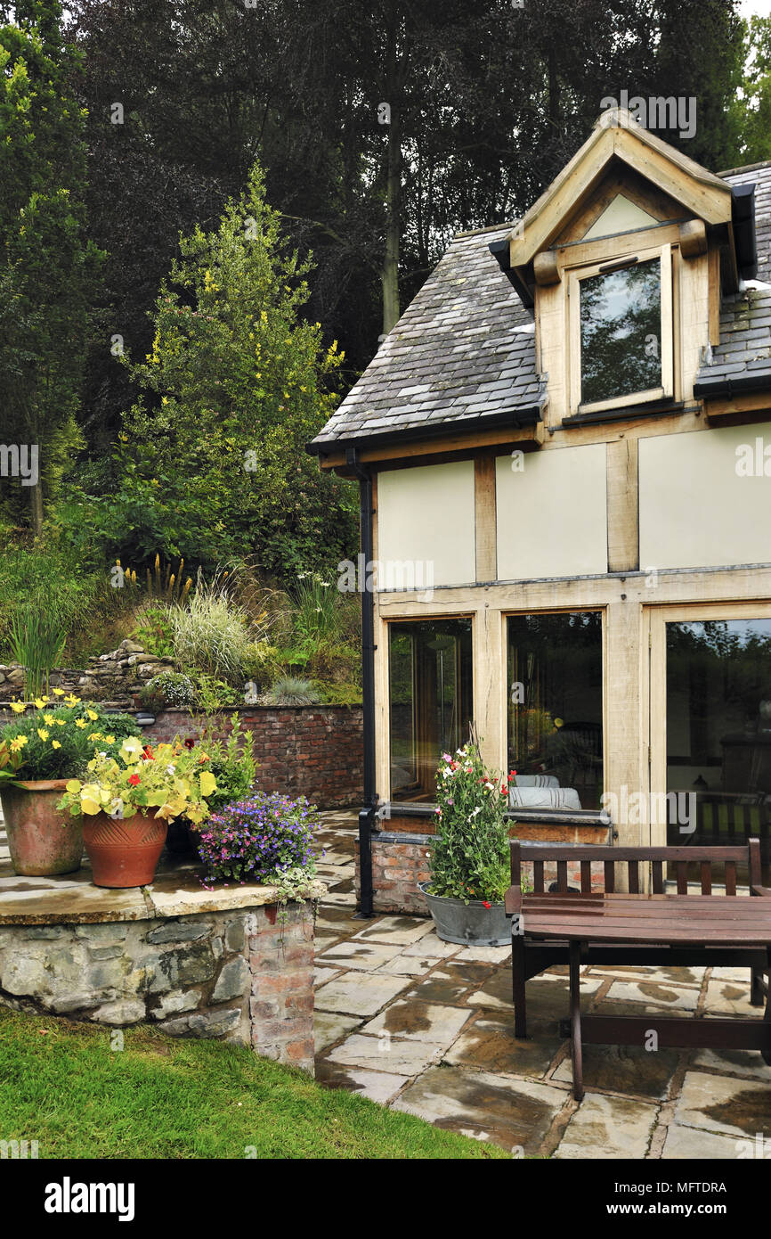 Exterior of traditional house and garden Stock Photo - Alamy