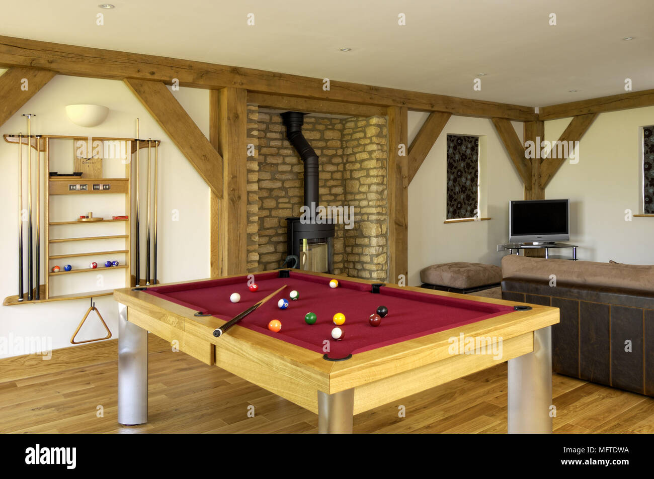 Modern country style games room with pool table Stock Photo