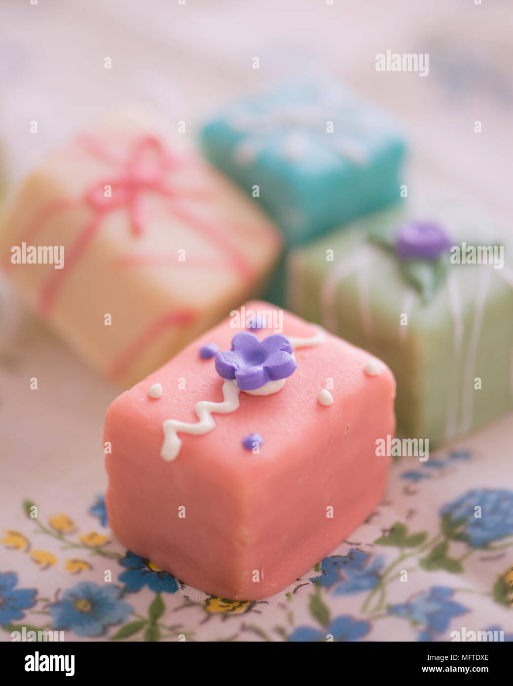 Petit fours in a variety of pastel shades Stock Photo