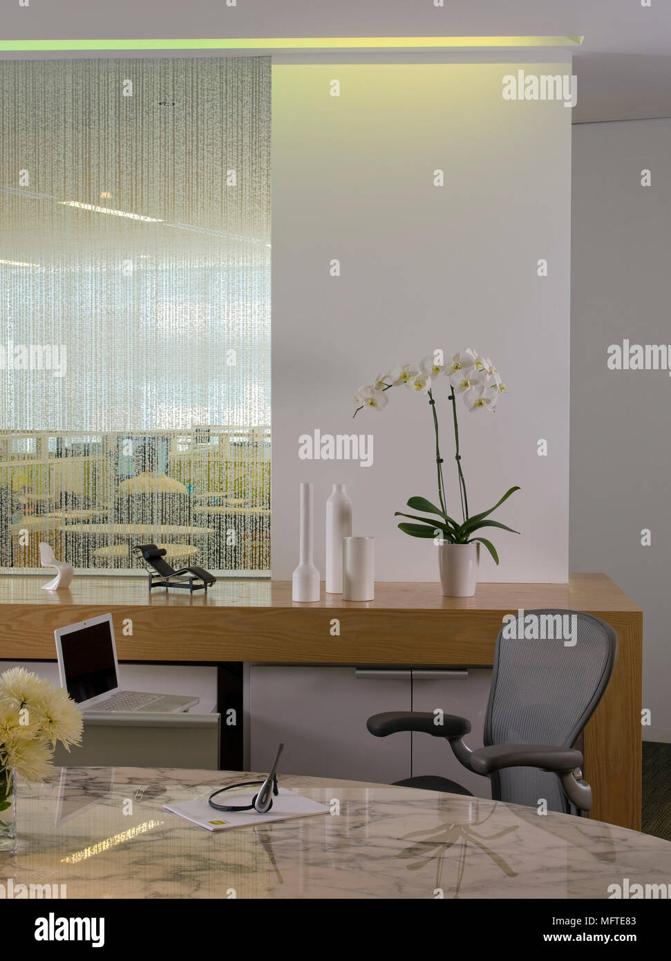 Chair at oval desk in modern office Stock Photo Alamy