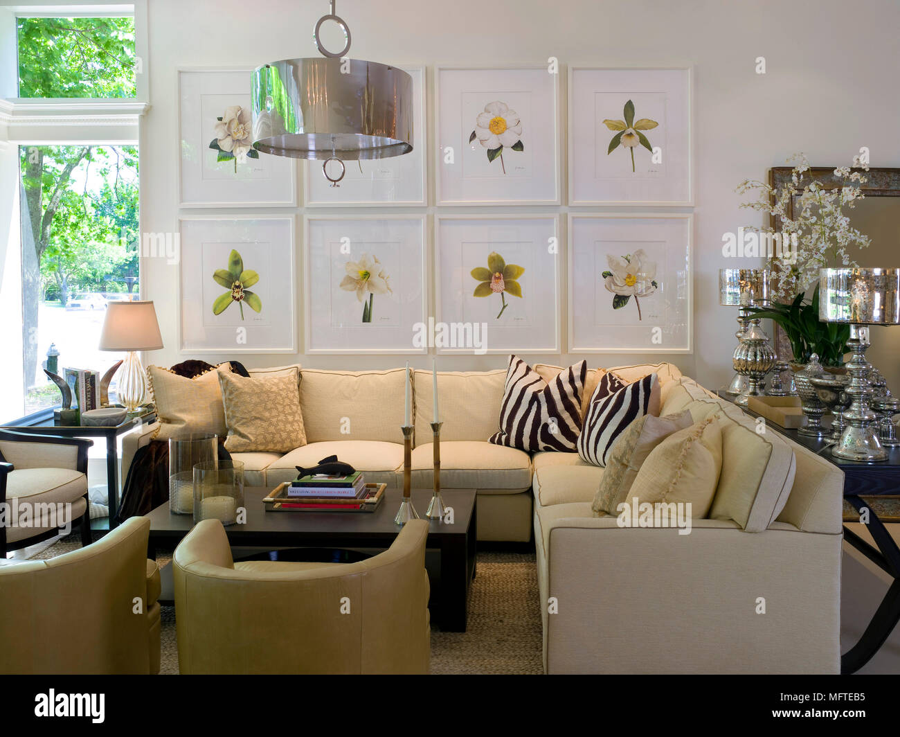 Upholstered seating around coffee table in modern sitting room Stock