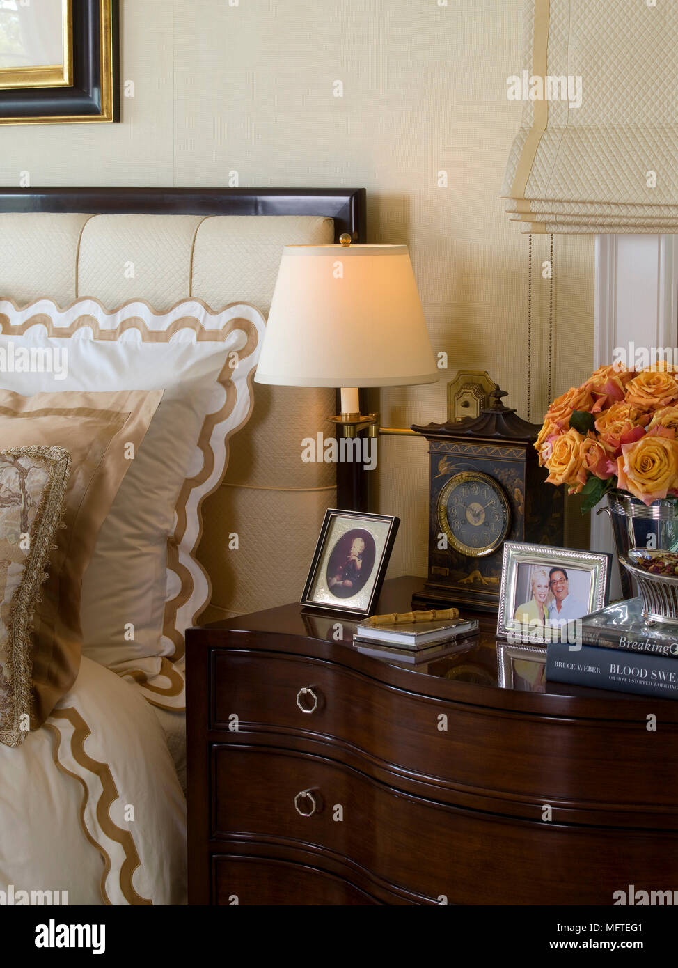 Floor lamp behind upholstered armchair and ottoman Stock Photo Alamy