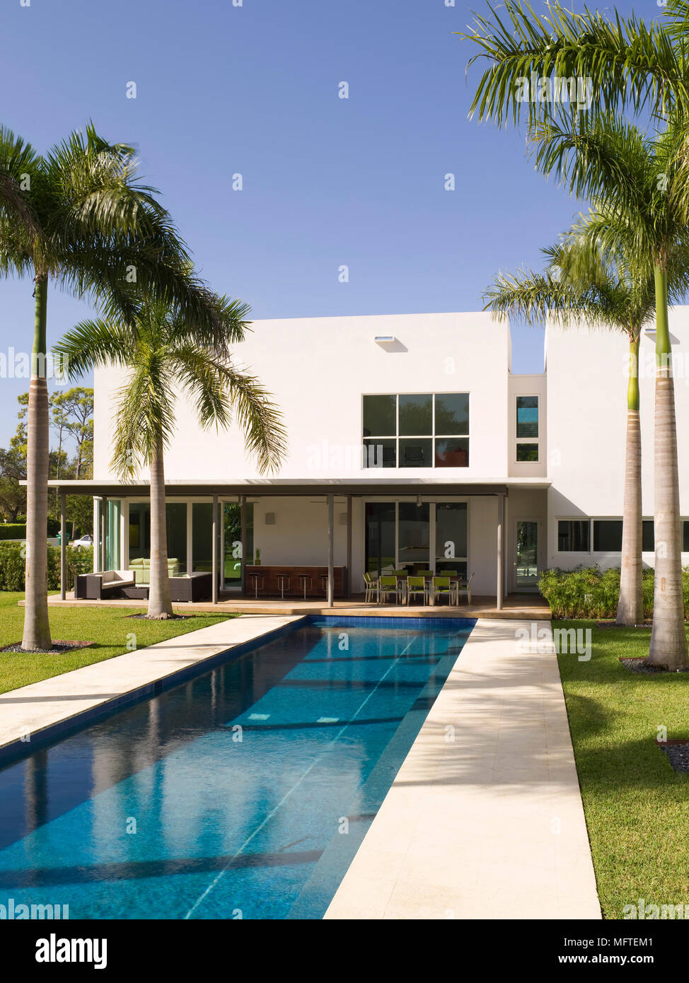 swimming pool in front of house