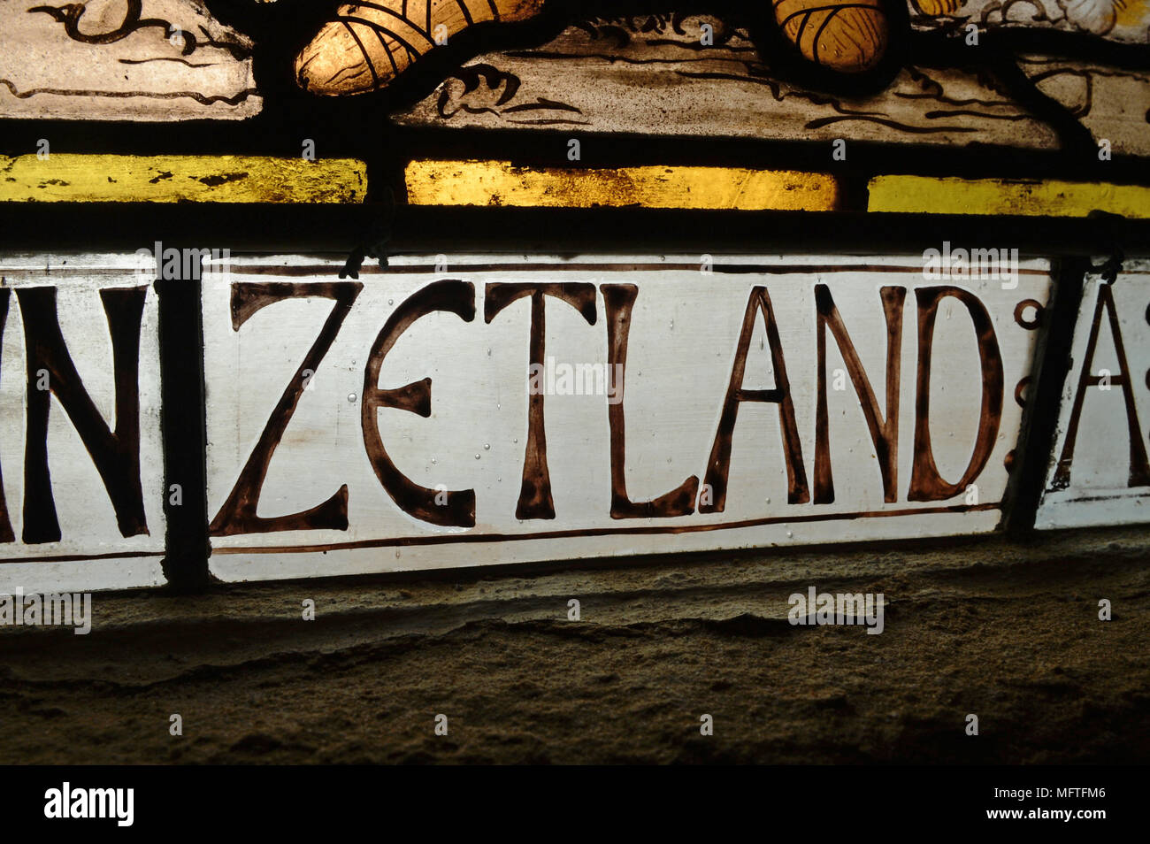 The word Zetland in a stain glass window an archaic word for Shetland Stock Photo