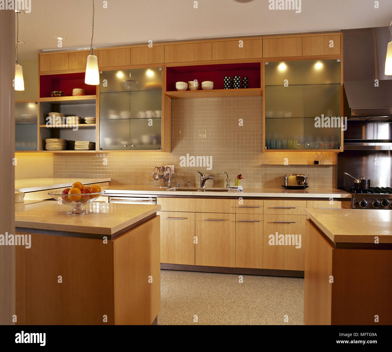 Modern kitchen wood units glass fronted cupboards tiled walls interiors