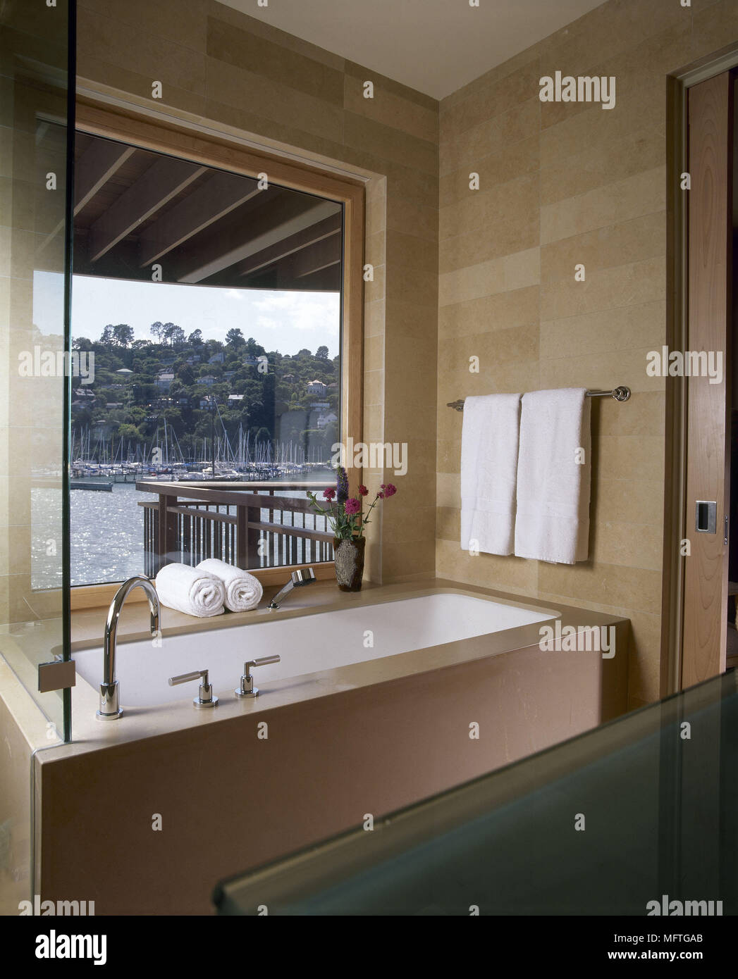 Modern neutral coloured bathroom with view from window USA Stock Photo