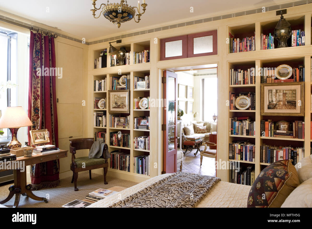 Built In Book Shelves In Traditional Style Bedroom Stock