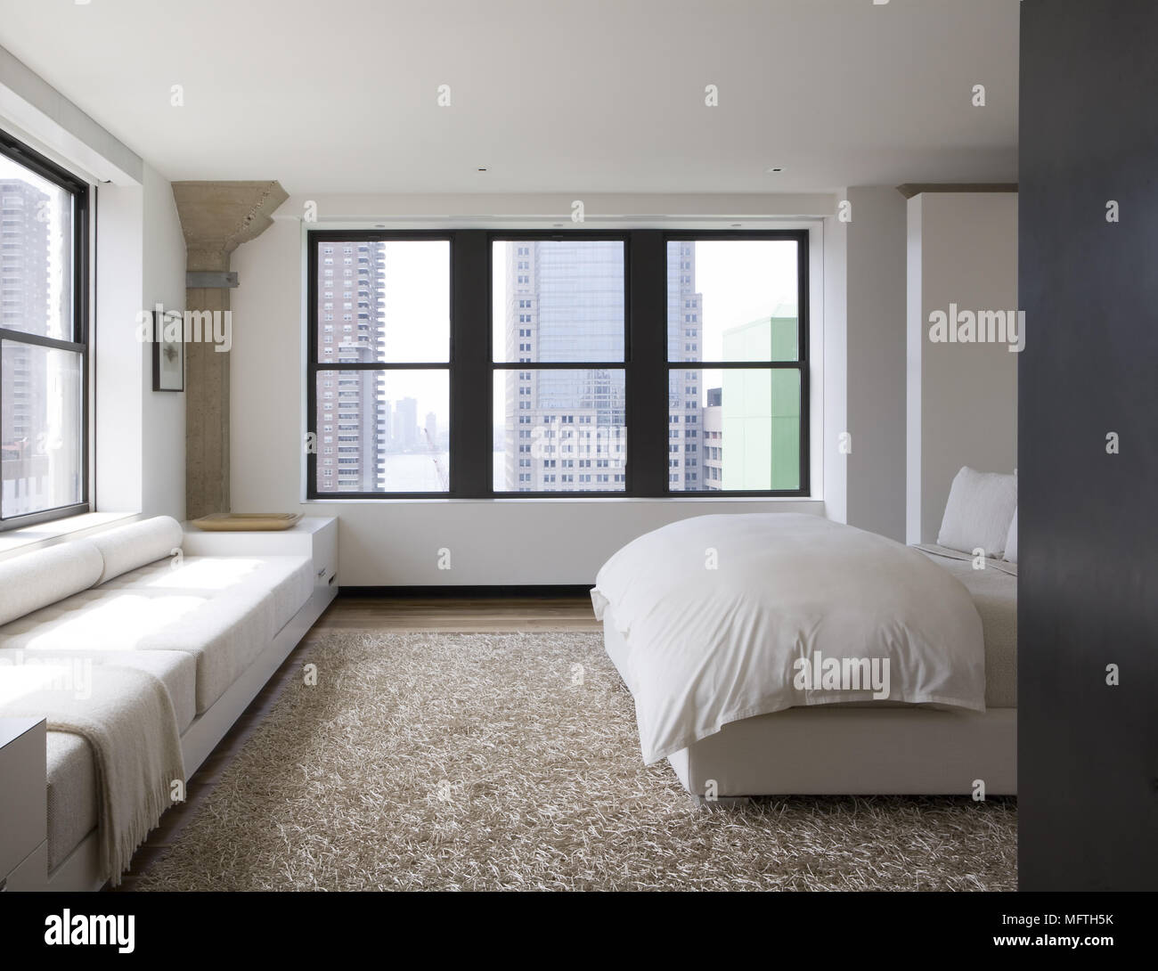 Built In Seating Under Window In Modern Bedroom Stock Photo