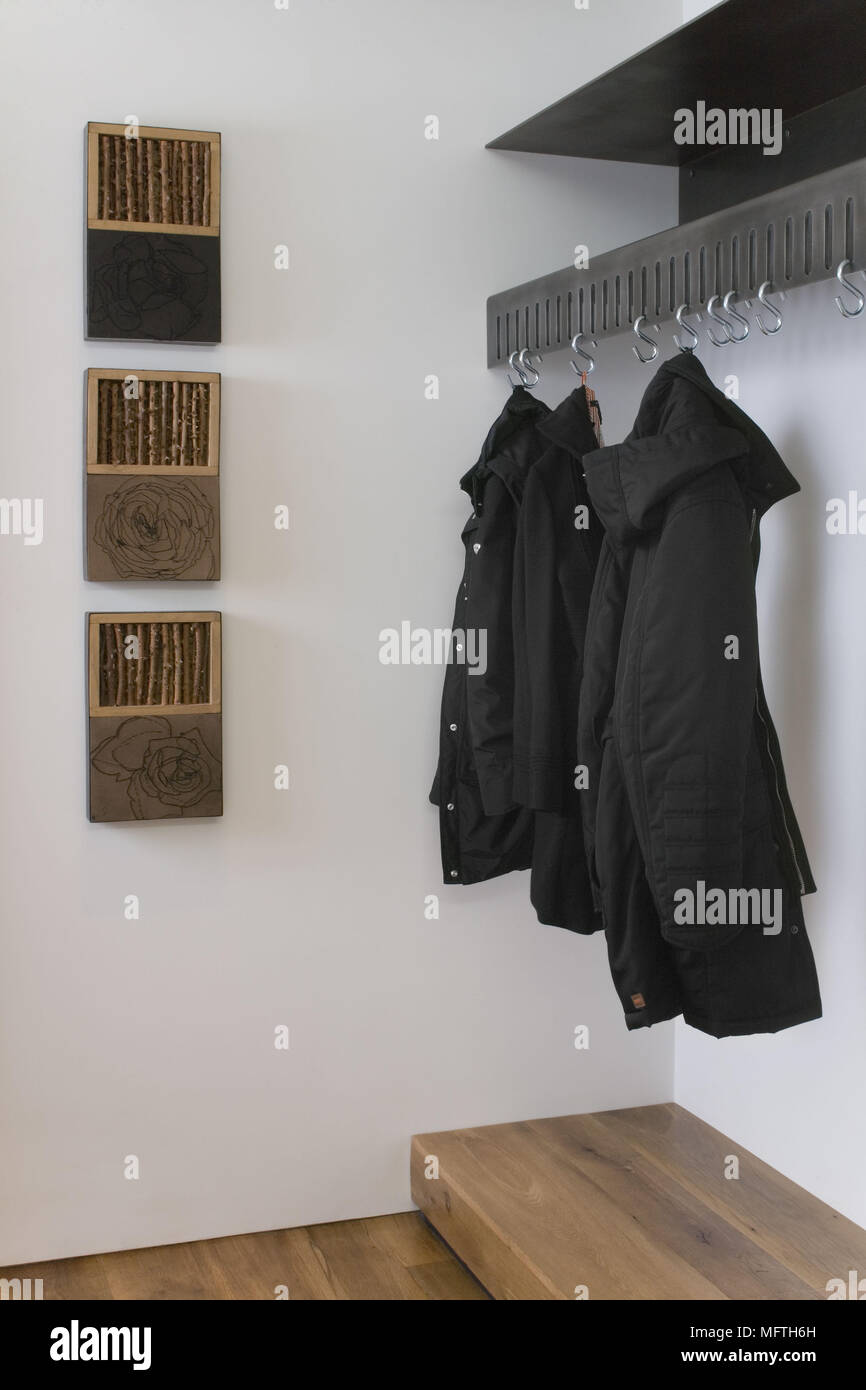 Coats hanging on a rack hi-res stock photography and images - Alamy