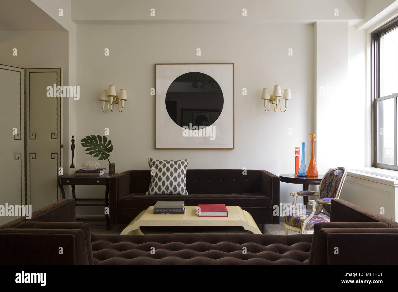 Pair of sofas facing each other over coffee table in modern sitting