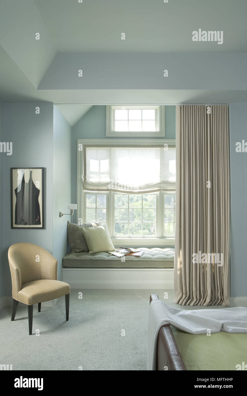 Window seat in modern blue bedroom Stock Photo Alamy