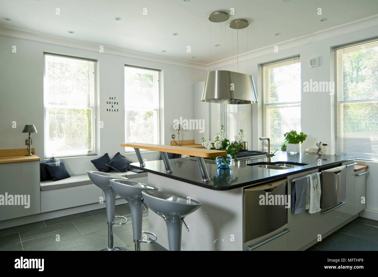 Contemporary kitchen with central island breakfast bar Stock Photo