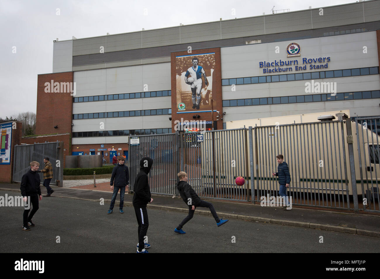 A group of young boys playing football at the back of the Blackburn End Stand before Blackburn Rovers played Shrewsbury Town in a Sky Bet League One fixture at Ewood Park. Both team were in the top three in the division at the start of the game. Blackburn won the match by 3 goals to 1, watched by a crowd of 13,579. Stock Photo