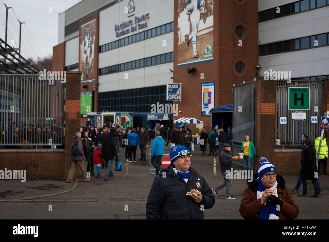 Fans gathering the outside the Blackburn End Stand before Blackburn Rovers played Shrewsbury Town in a Sky Bet League One fixture at Ewood Park. Both team were in the top three in the division at the start of the game. Blackburn won the match by 3 goals to 1, watched by a crowd of 13,579. Stock Photo