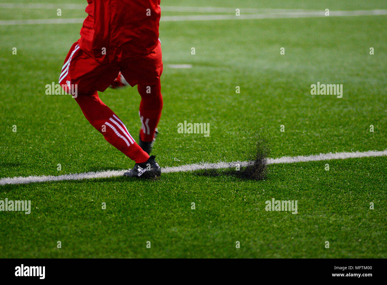 MINSK, BELARUS - MARCH 31, 2018: Goalkeeper hits the ball during the Belarusian Premier League football match between FC Dynamo Minsk and FC Torpedo at the FC Minsk Stadium. Stock Photo