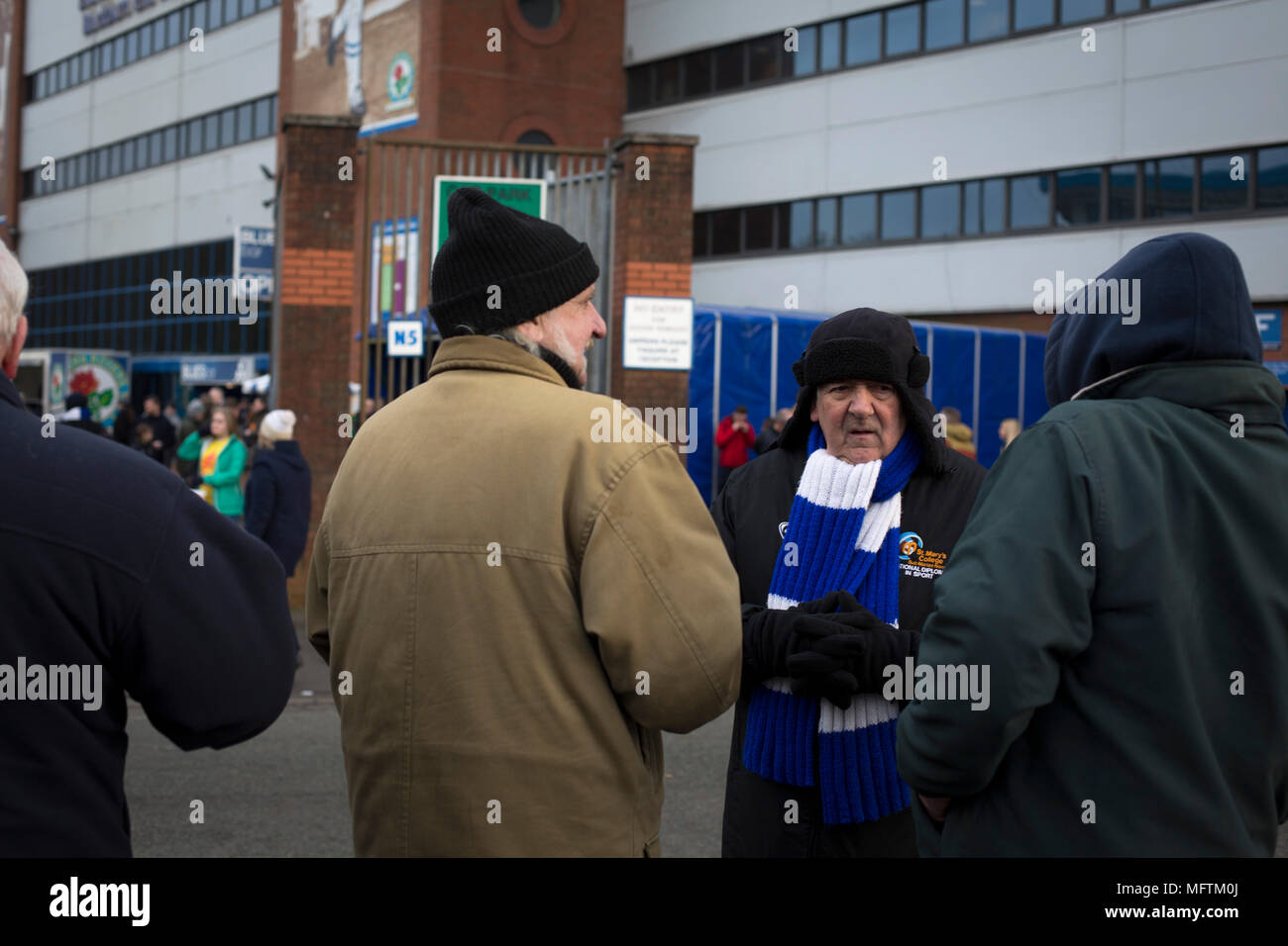 Fans gathering the outside the Blackburn End Stand before Blackburn Rovers played Shrewsbury Town in a Sky Bet League One fixture at Ewood Park. Both team were in the top three in the division at the start of the game. Blackburn won the match by 3 goals to 1, watched by a crowd of 13,579. Stock Photo