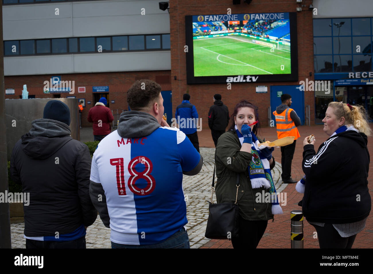 Fans gathering the outside the Blackburn End Stand before Blackburn Rovers played Shrewsbury Town in a Sky Bet League One fixture at Ewood Park. Both team were in the top three in the division at the start of the game. Blackburn won the match by 3 goals to 1, watched by a crowd of 13,579. Stock Photo
