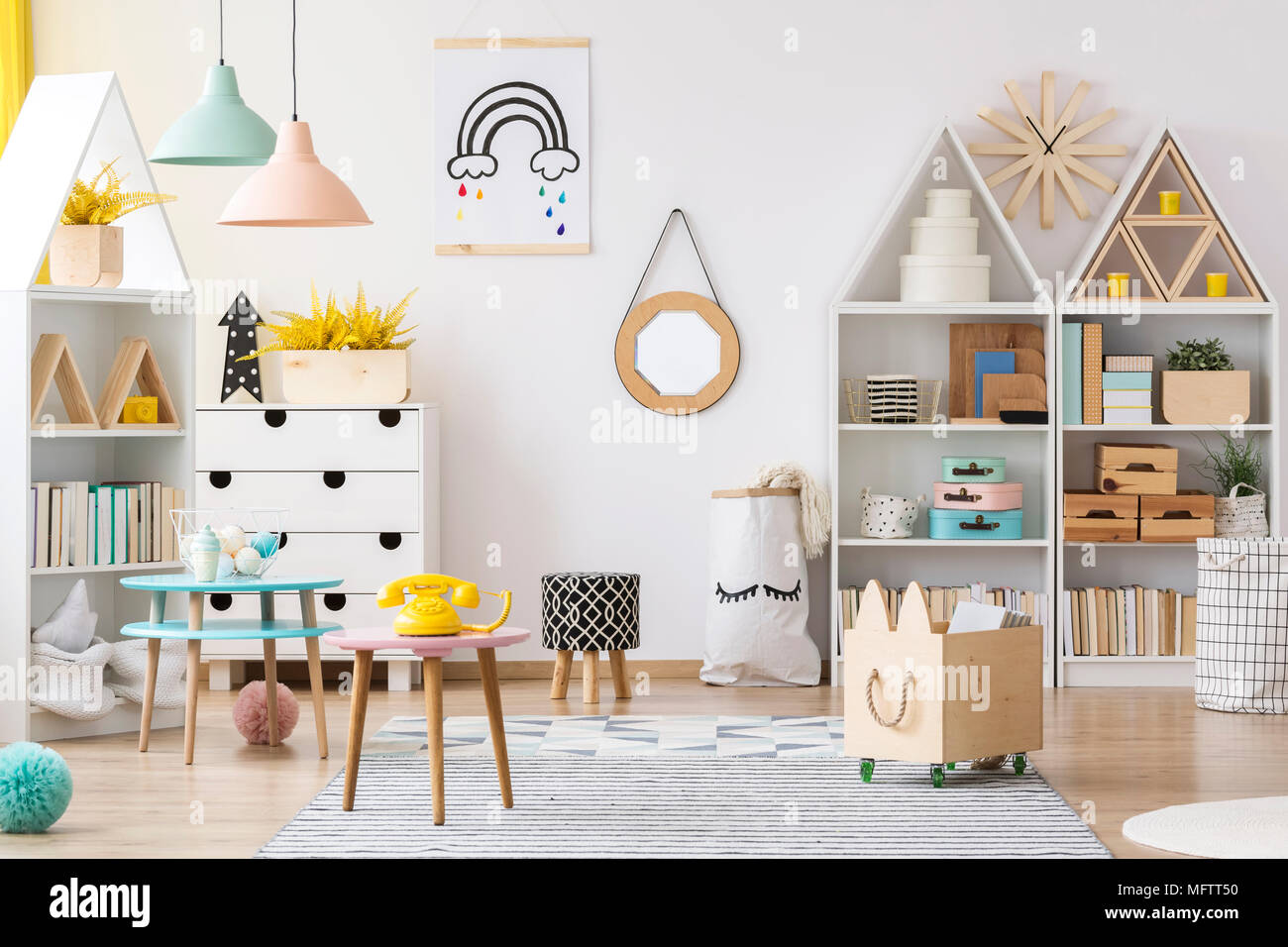 Mirror in wooden frame hanging on the wall in white room interior for ...