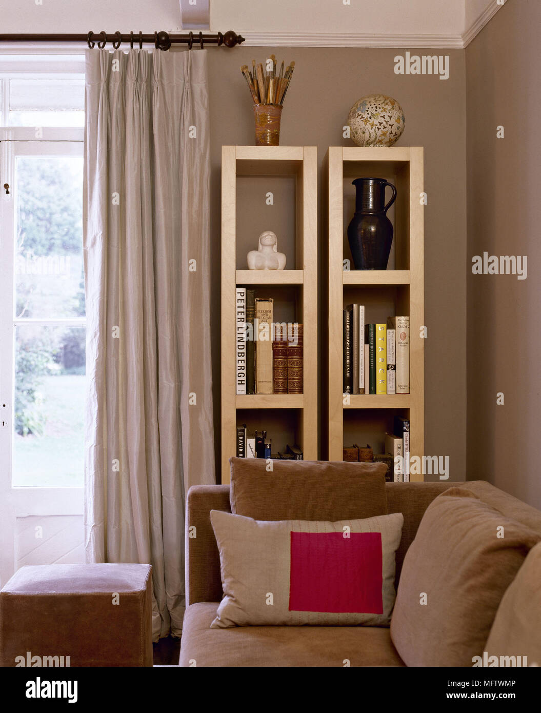 Corner of sitting room with bookcase and french doors. Stock Photo