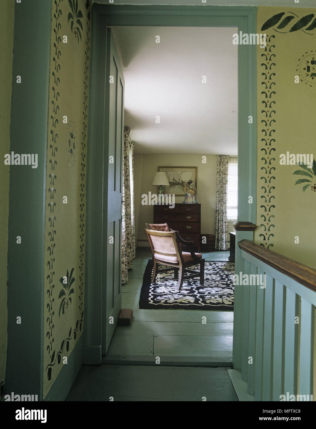 View Through Doorway To Traditional Bedroom With Stencil Patterns