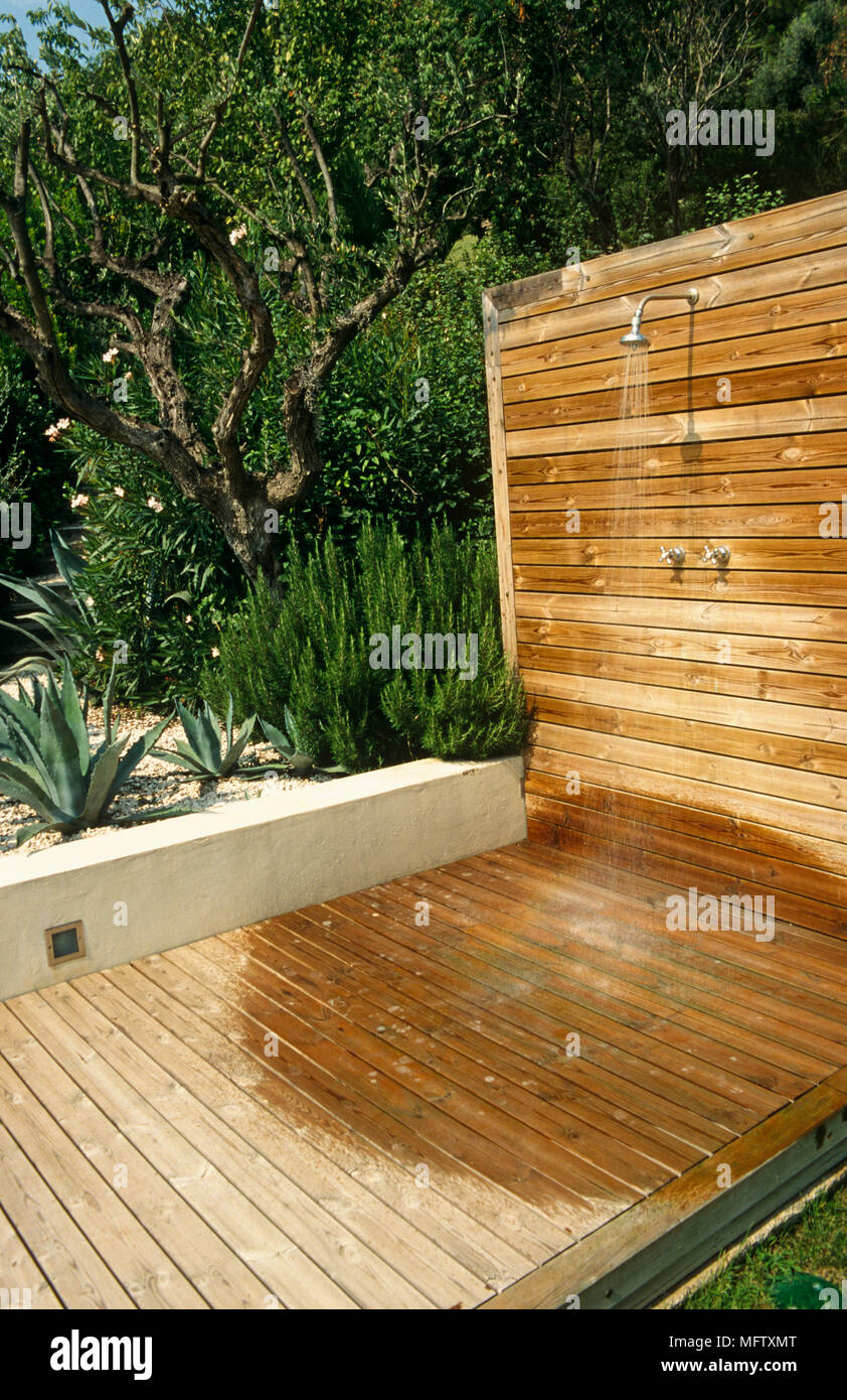 Shower built into wooden decking around swimming pool Stock Photo Alamy