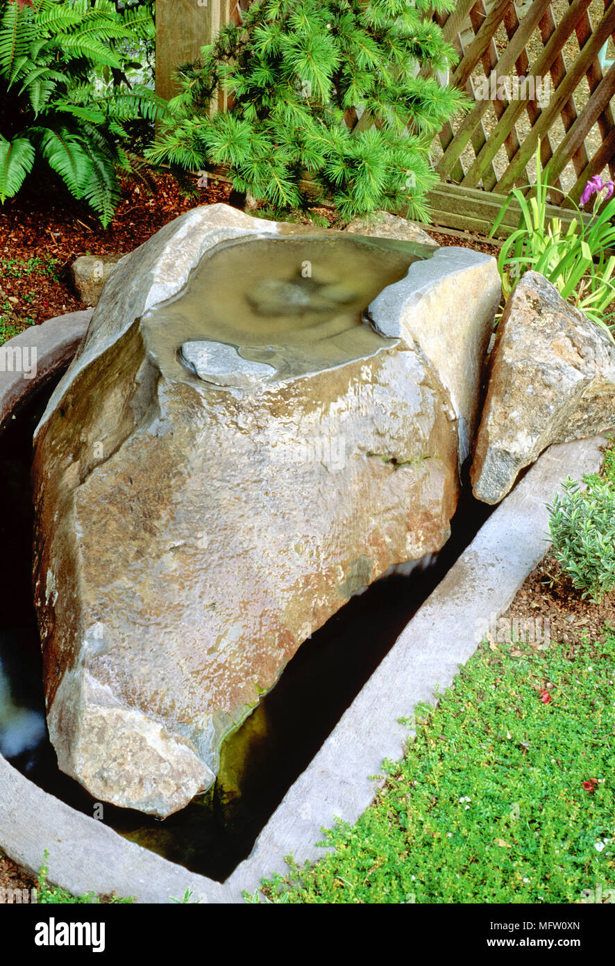 Contemporary water feature in garden Stock Photo