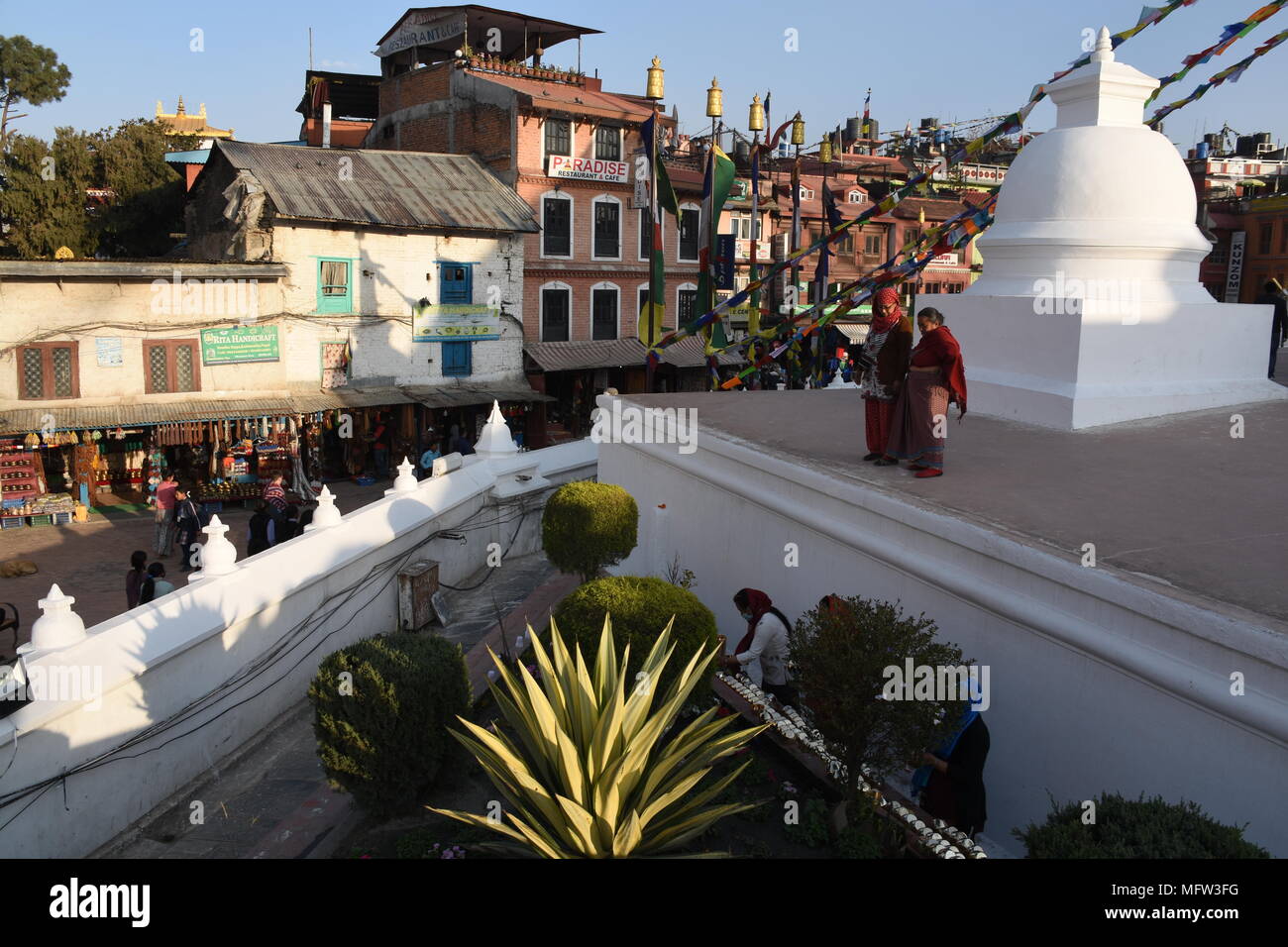 Kathmandu, Nepal - March 5, 2018 Woman prepare singing bowls inside Boudhanath Stupa Stock Photo