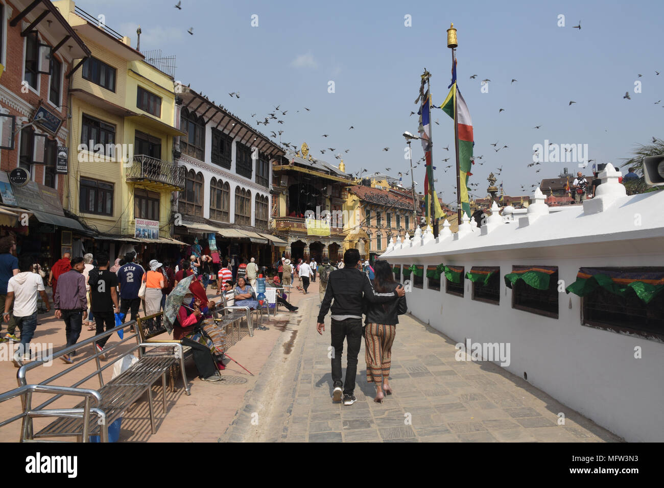 Kathmandu, Nepal - March 23, 2018: Couple walking around the Boudhanath Stupa Stock Photo