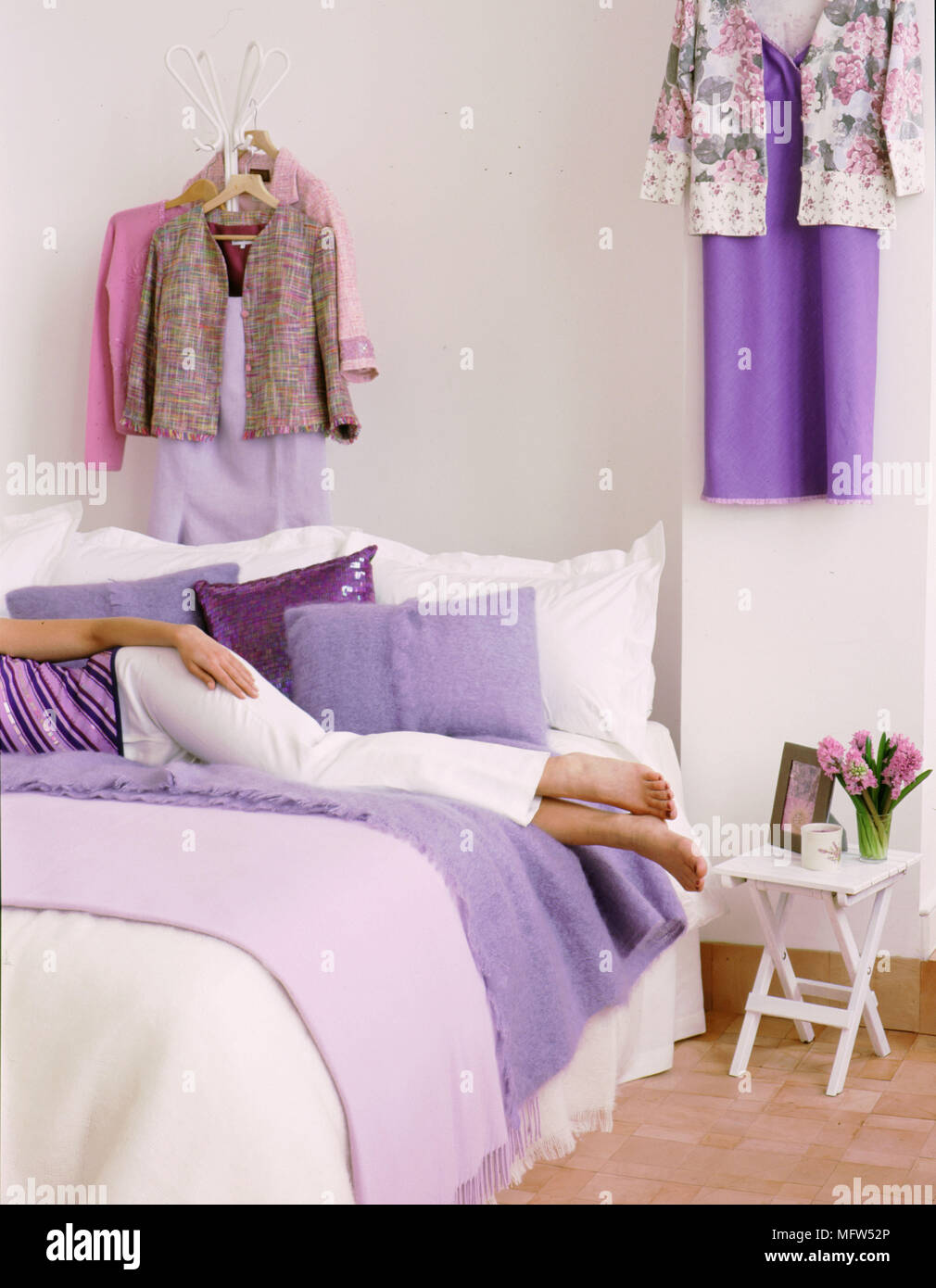 Modern White Bedroom Detail Woman Lying On Bed Lilac Cover