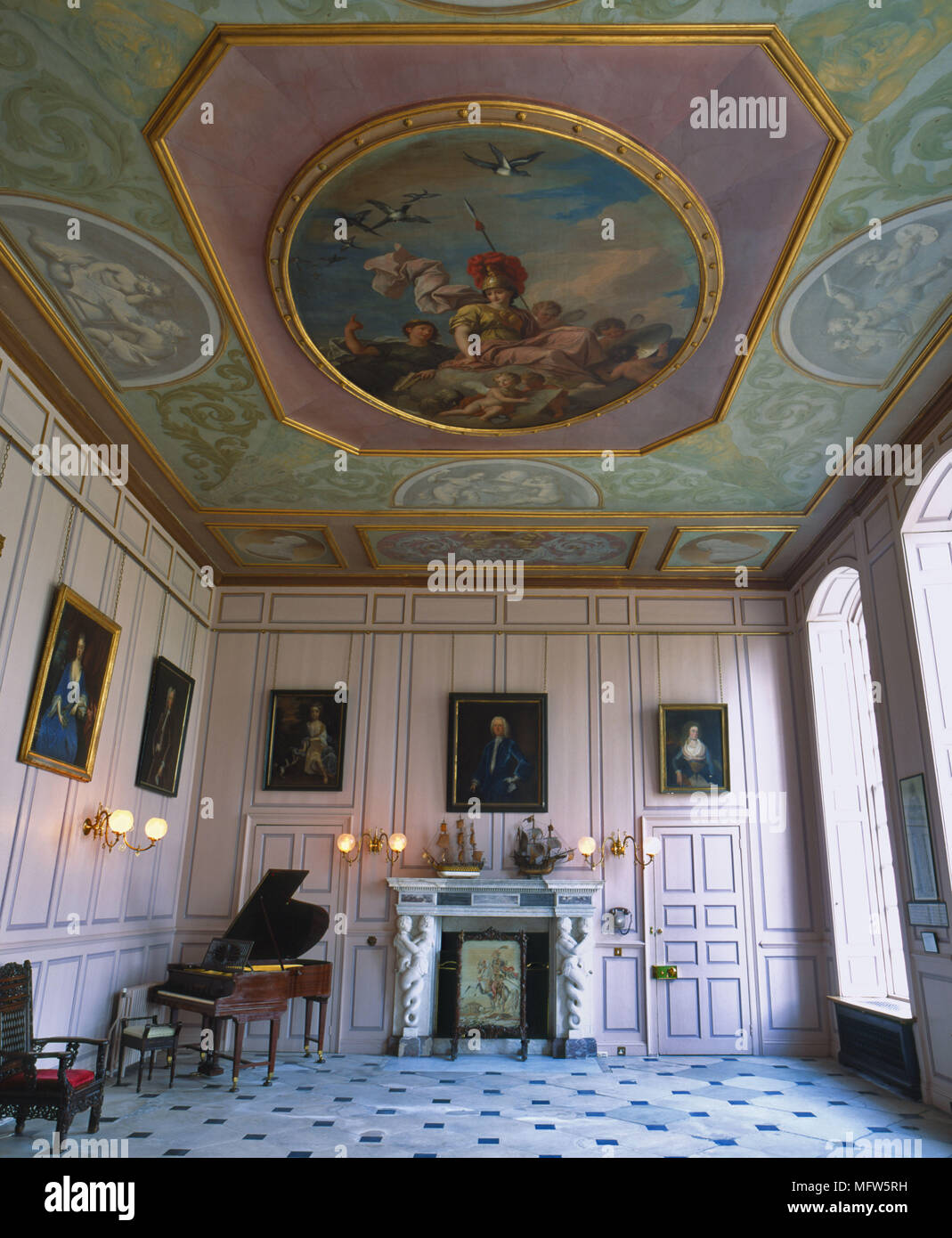 A Traditional Grand Pink Music Room With Moulded Panelling Painted