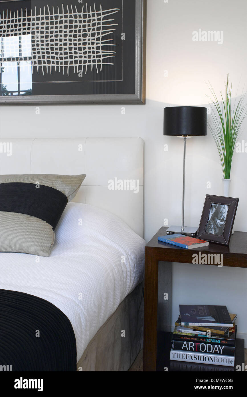 Monochrome bedside table headboard and bed linen Stock Photo Alamy