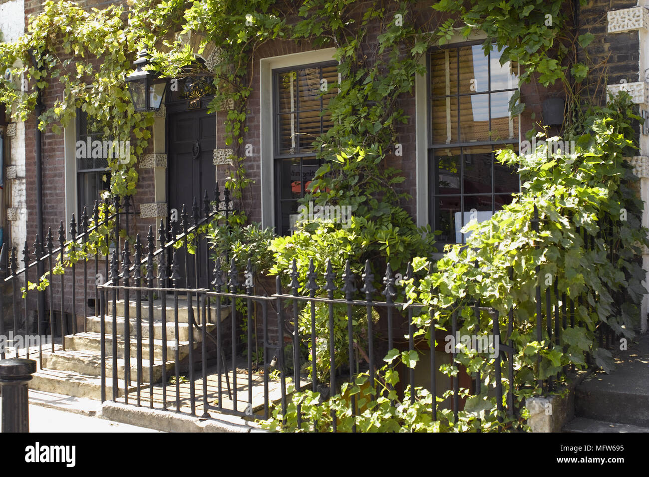 The exterior of a terraced house with steps leading up to the front ... The exterior of a terraced house with steps leading up to the front ...