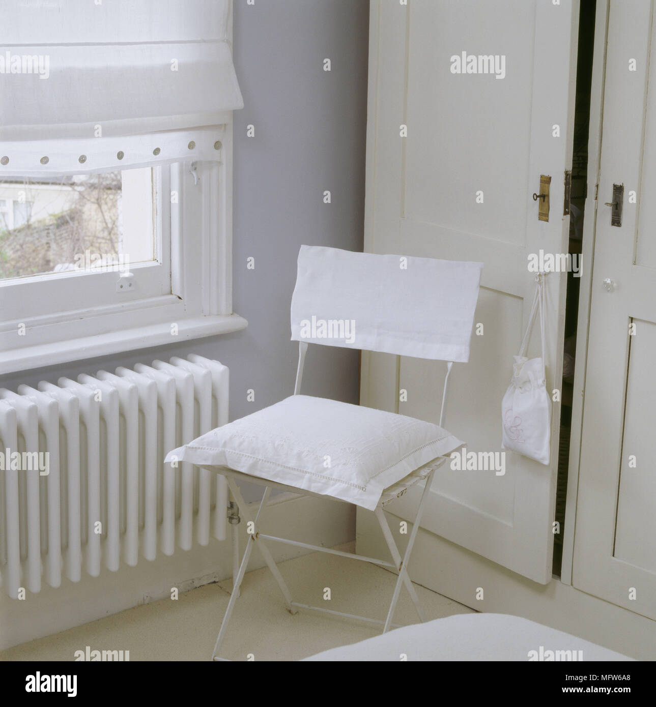 A Detail Of A Country Bedroom Showing A Built In Wardrobe Painted