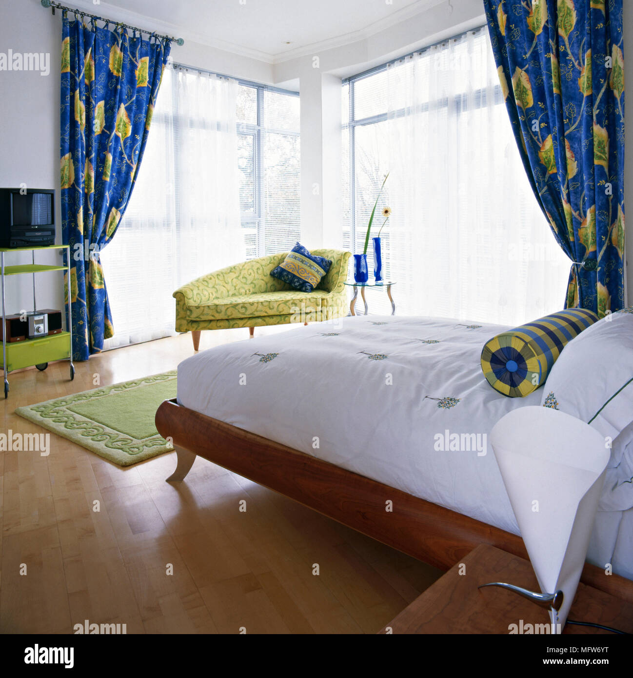 Double Bed In Double Aspect Bedroom With Vibrant Blue And