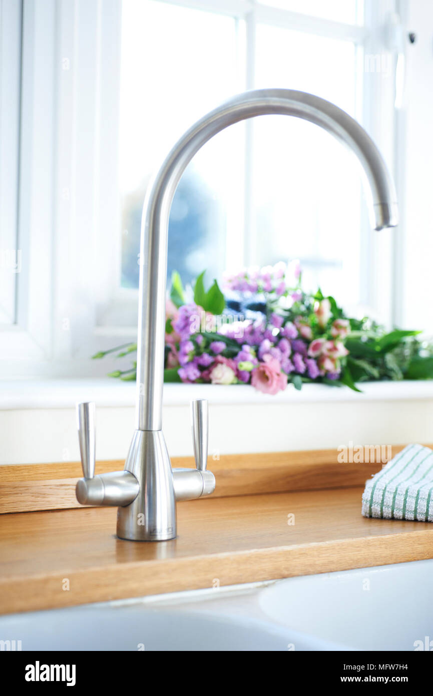 Mixer tap fitting in brushed steel finish Stock Photo