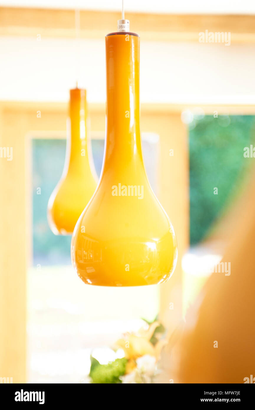 Vibrant yellow pendant lights Stock Photo Alamy