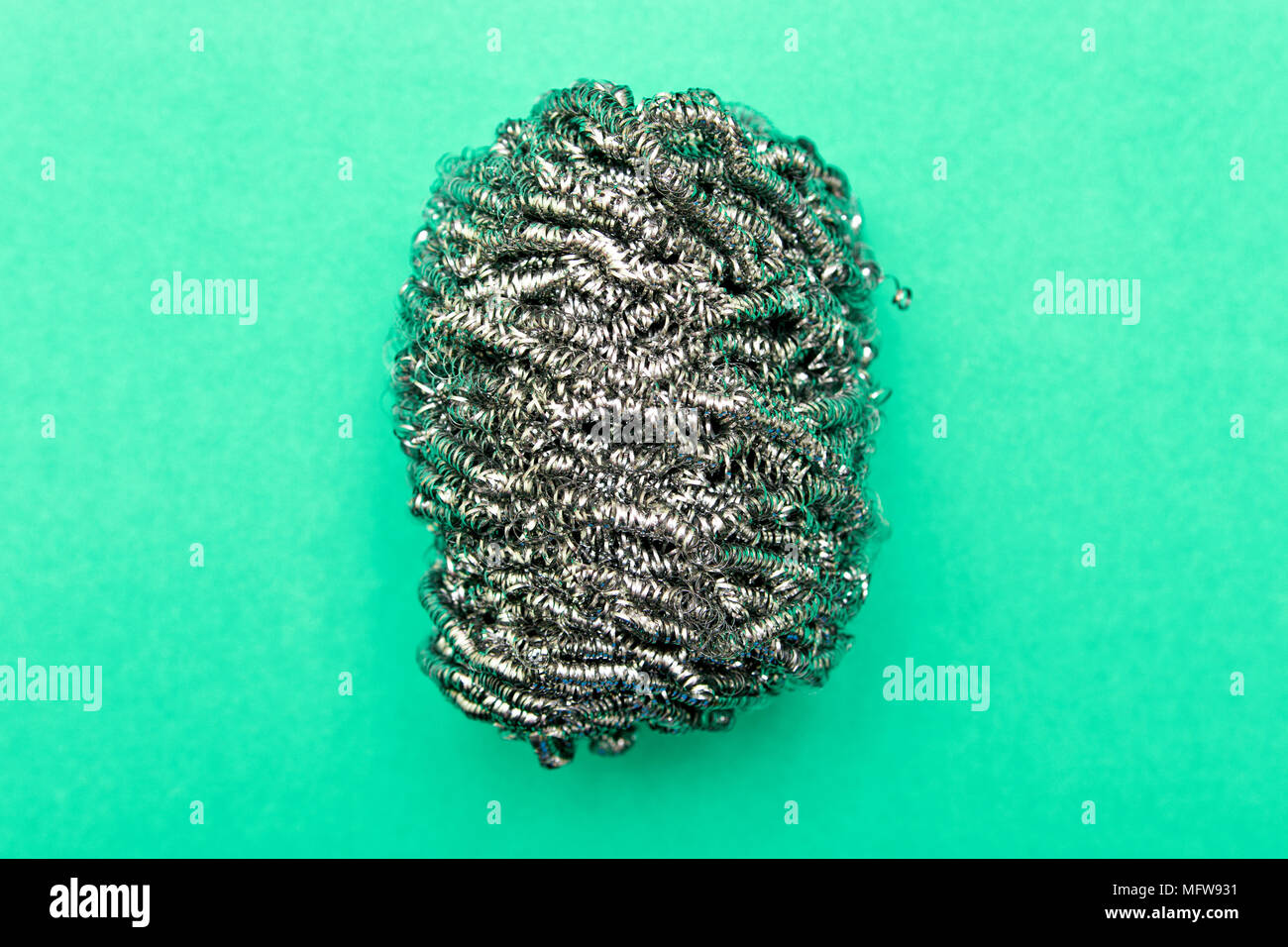 Metal sponge for washing dishes closeup on a colored background with copy space Stock Photo Alamy