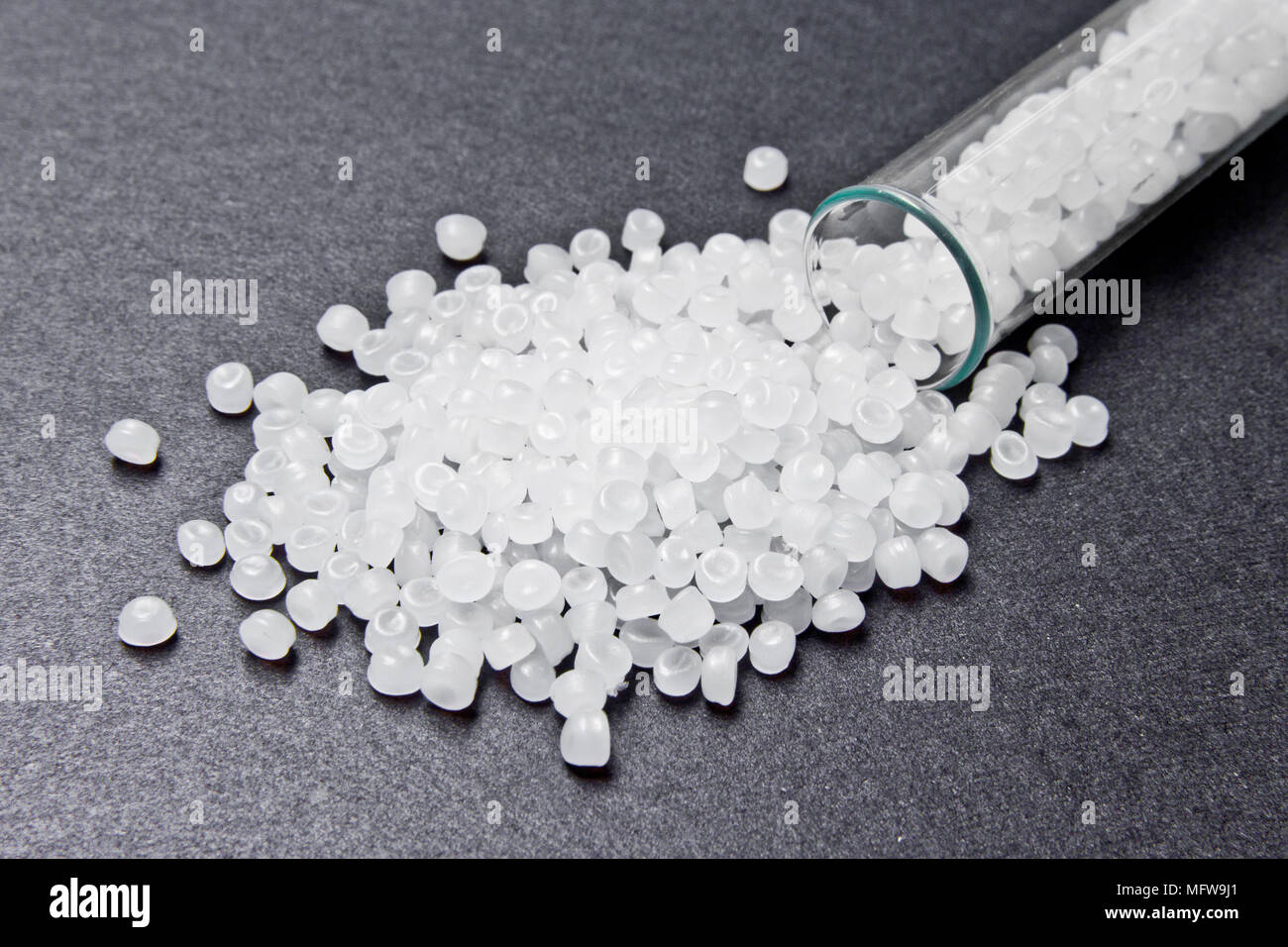 Plastic pellets. Transparent Polyethylene granules. Plastic Raw material .High Density Polyethylene (PE-HD).  PE-LD Stock Photo